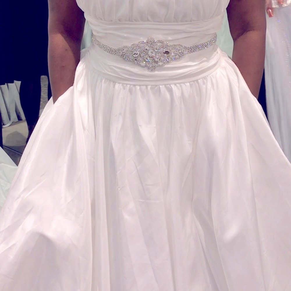 Size 14 wedding gown from David Bridal. Never been worn with tags attached